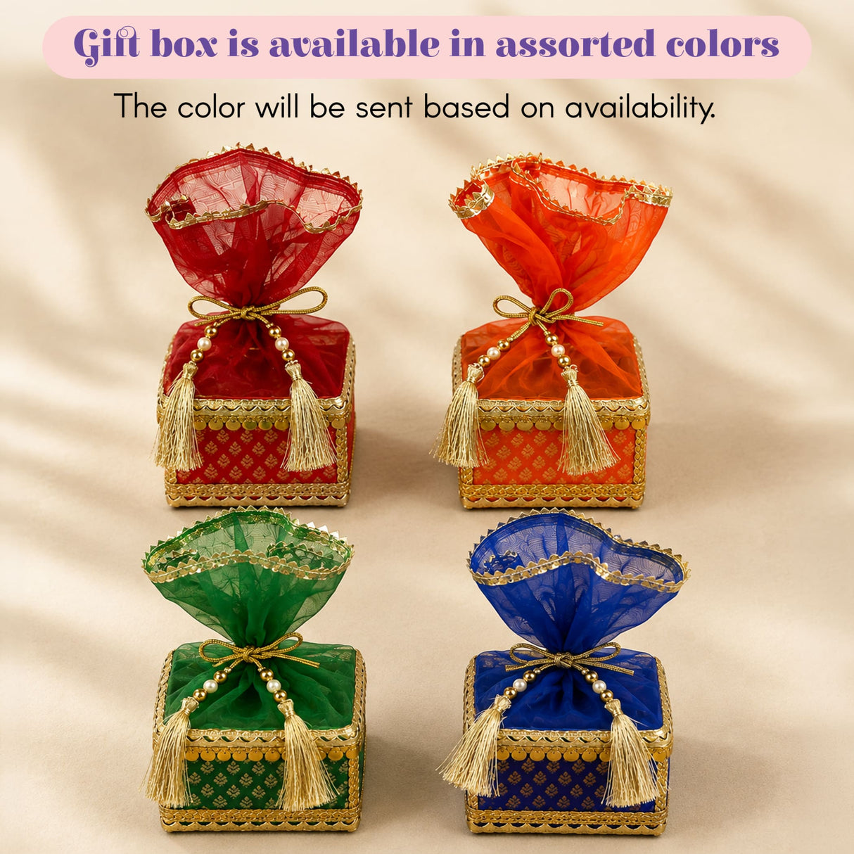 Elegant raksha bandhan premium gift hamper with red orange green blue square boxes and gold-trimmed organza bows
