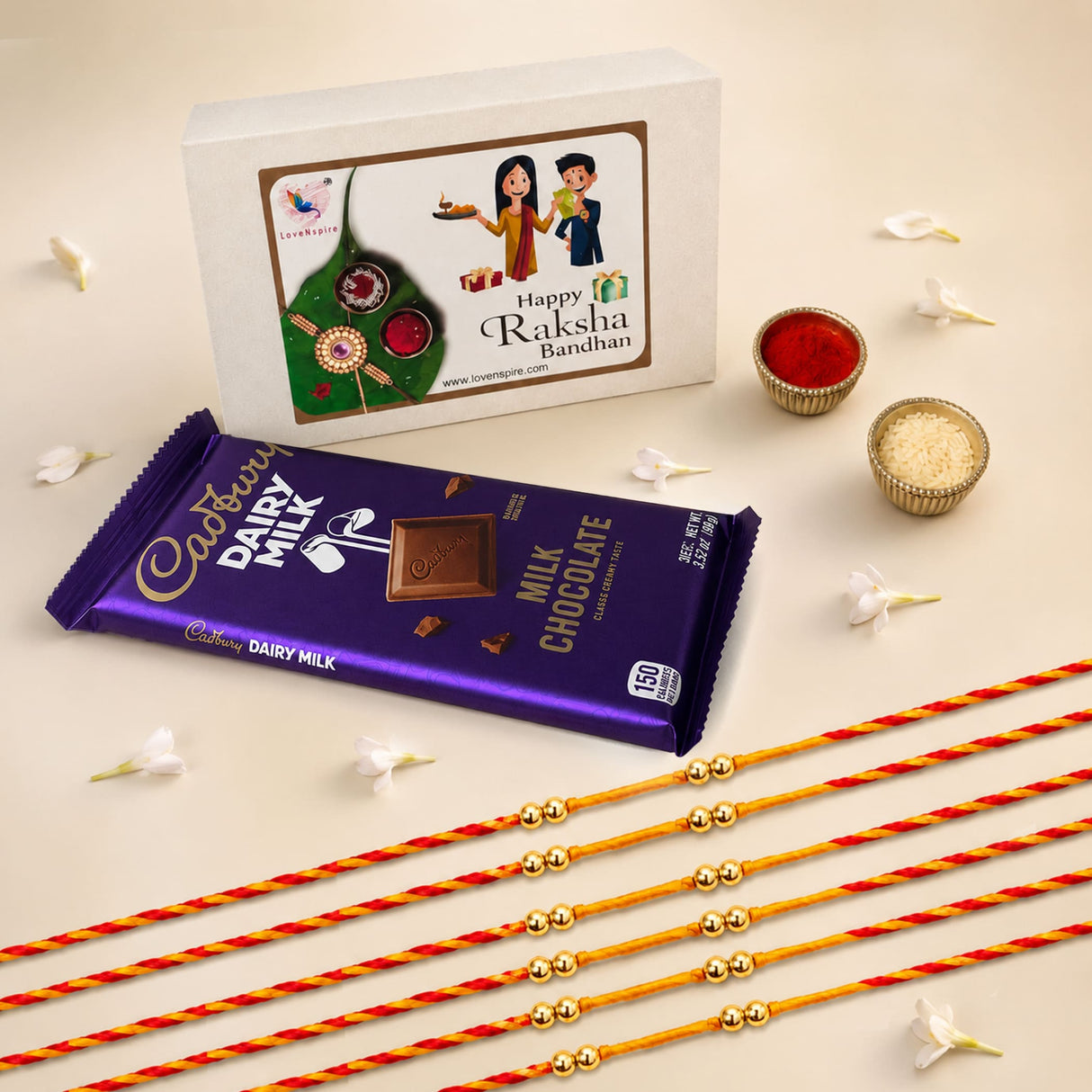 Rakhi gift hamper set with purple cadbury dairy milk chocolate bar in gold foil packaging for brother and bhabhi