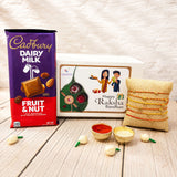 Purple and red cadbury dairy milk fruit and nut chocolate bar with golden logo in rakhi gift hamper for brother and bhabhi