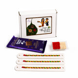 Purple cadbury dairy milk chocolate bar with gold foil and white text included in rakhi gift hamper for brother and bhabhi