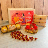 Gold and red beaded rakhi with decorative design in handmade raksha bandhan gift hamper for brother and bhabhi
