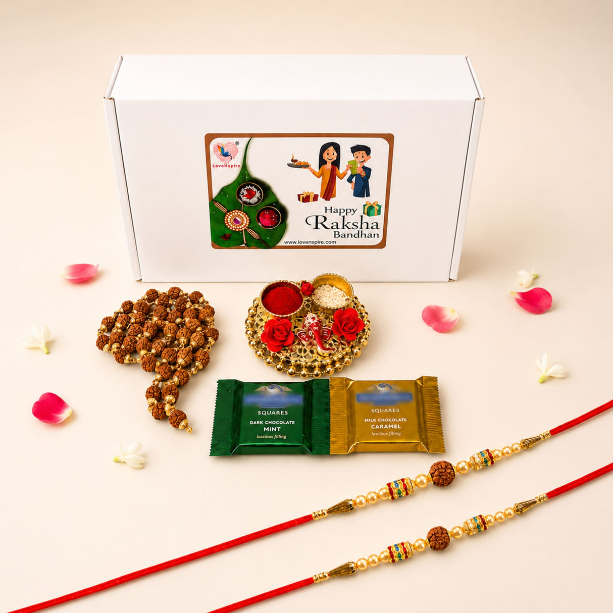 Red rakhi with golden and beaded embellishments included in raksha bandhan gift hamper for brother and bhabhi