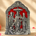 Silver-colored ornate metal plaque depicting vishnu lakshmi and garuda in an arched frame for pooja and home decor