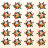 Colorful rangoli diya set with intricately designed red and green leaf patterns and central white tea light candle for diwali decor
