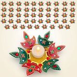 Colorful ornate rangoli diya set with red green petals swastika symbols and gemstones for decorative diwali decor