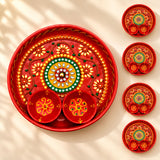 Decorative pooja thali red metal serving tray with intricate gold green yellow floral patterns and attached bowls for rituals