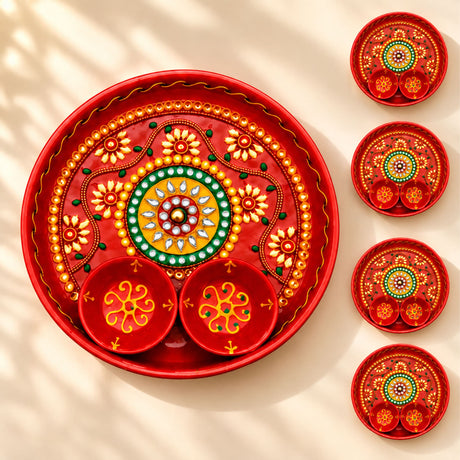 Decorative pooja thali red metal serving tray with intricate gold green yellow floral patterns and attached bowls for rituals