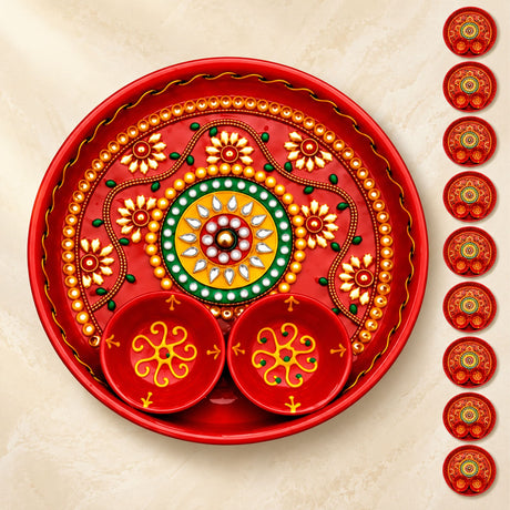 Decorative pooja thali metal plate in red with gold green floral patterns and attached bowls for haldi kumkum rituals