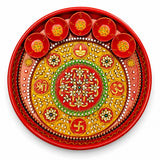 Vibrant red handmade pooja thali with gold green floral patterns rhinestones and 5 diya bowls for aarti rituals