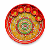 Vibrant red handmade pooja thali with rhinestone embellishments and six matching diya bowls for rituals and festivals