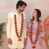 Red gold velvet Varmala garland with green accents for Indian wedding bride groom