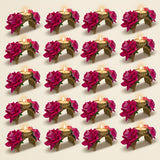 Gold-toned rose diwali candle holders with intricate detailing and vibrant magenta artificial roses for festive decor