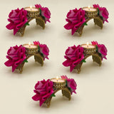 Gold-toned rose diwali candle holder with vibrant fuchsia artificial roses and intricate filigree detailing for festive decor