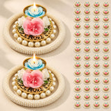 Elegant gold-toned rose pearl tea light candle holders with faux pearls and blue rose candles for festive home decor