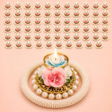 A delicate gold-toned rose pearl tealight candle holder with pink white artificial flower and pearls for festive decor