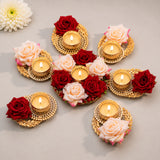 Gold-colored ornate rose tea light candle holders with intricate lace-like patterns for festive Diwali and Rangoli decor