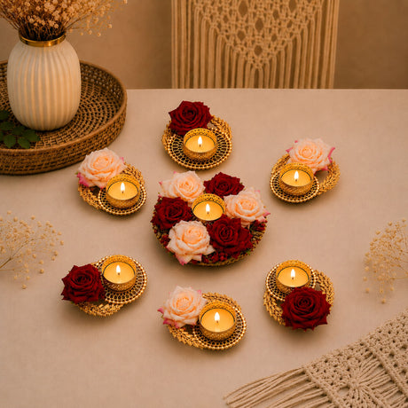 Gold-toned metal rose tea light candle holders with woven design and red or peach roses for festive rangoli decor set of 7