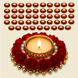 A lit golden ornate rose candle holder adorned with red roses and gold beads for festive home décor and dining tables