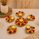 Gold metal rose tealight rangoli candle holders with red yellow artificial roses and white pearls for festive decor