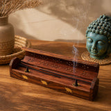Handmade rosewood incense stick holder with gold elephant inlays and perforated top emitting gentle smoke