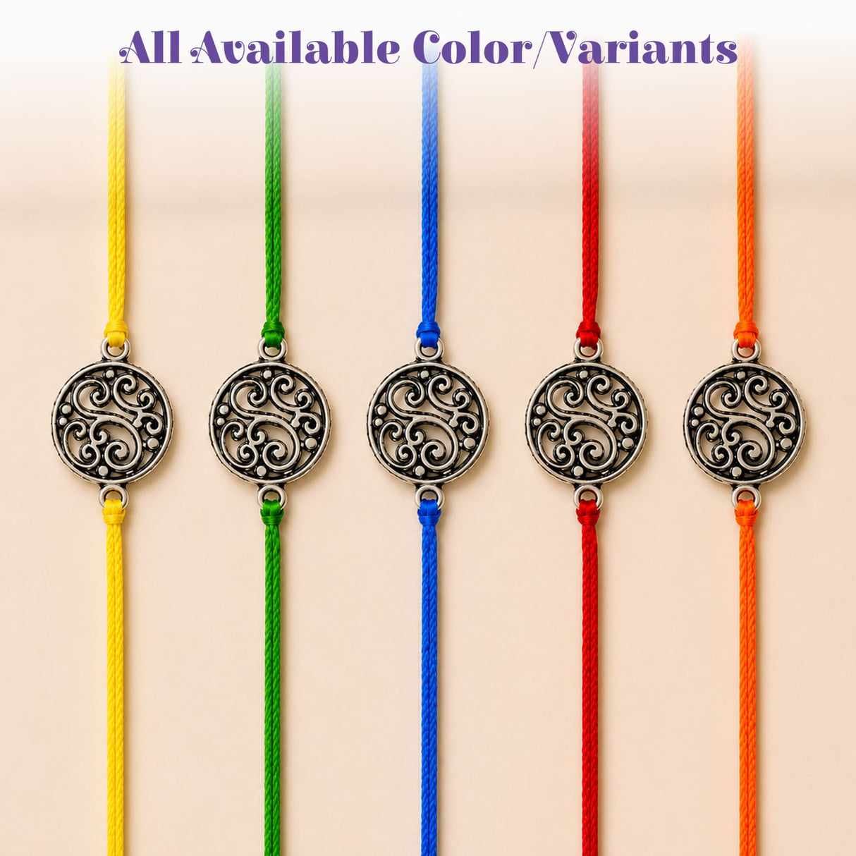 Silver-toned circular floral charm with intricate patterns on colorful braided cords for raksha bandhan gift set