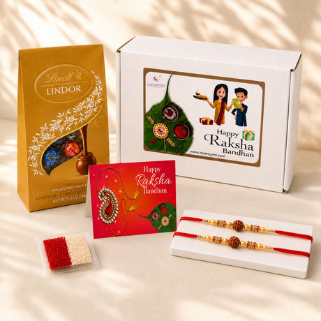 Gold-colored lindt lindor chocolate box with floral patterns and window in raksha bandhan gift hamper for brother and bhabhi