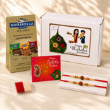 Raksha bandhan gift hamper featuring red and gold rudraksha bead rakhi bracelets with ornate paisley card and decorative beads