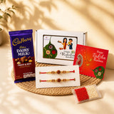 A vibrant red and gold raksha bandhan gift hamper with handmade rudraksha bead rakhi bracelets greeting card and chocolate