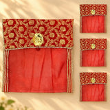 Red embroidered fabric saree cover with gold floral patterns and central golden clasp for wardrobe storage and travel