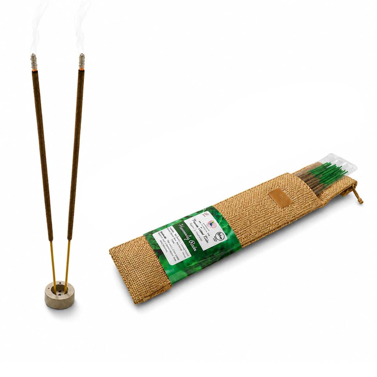 Two slender brown premium scented incense sticks with silver tips standing in a beige ceramic holder for pooja use