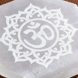 Selenite charging plate with translucent hexagonal shape and white lotus om design for crystal healing and decor