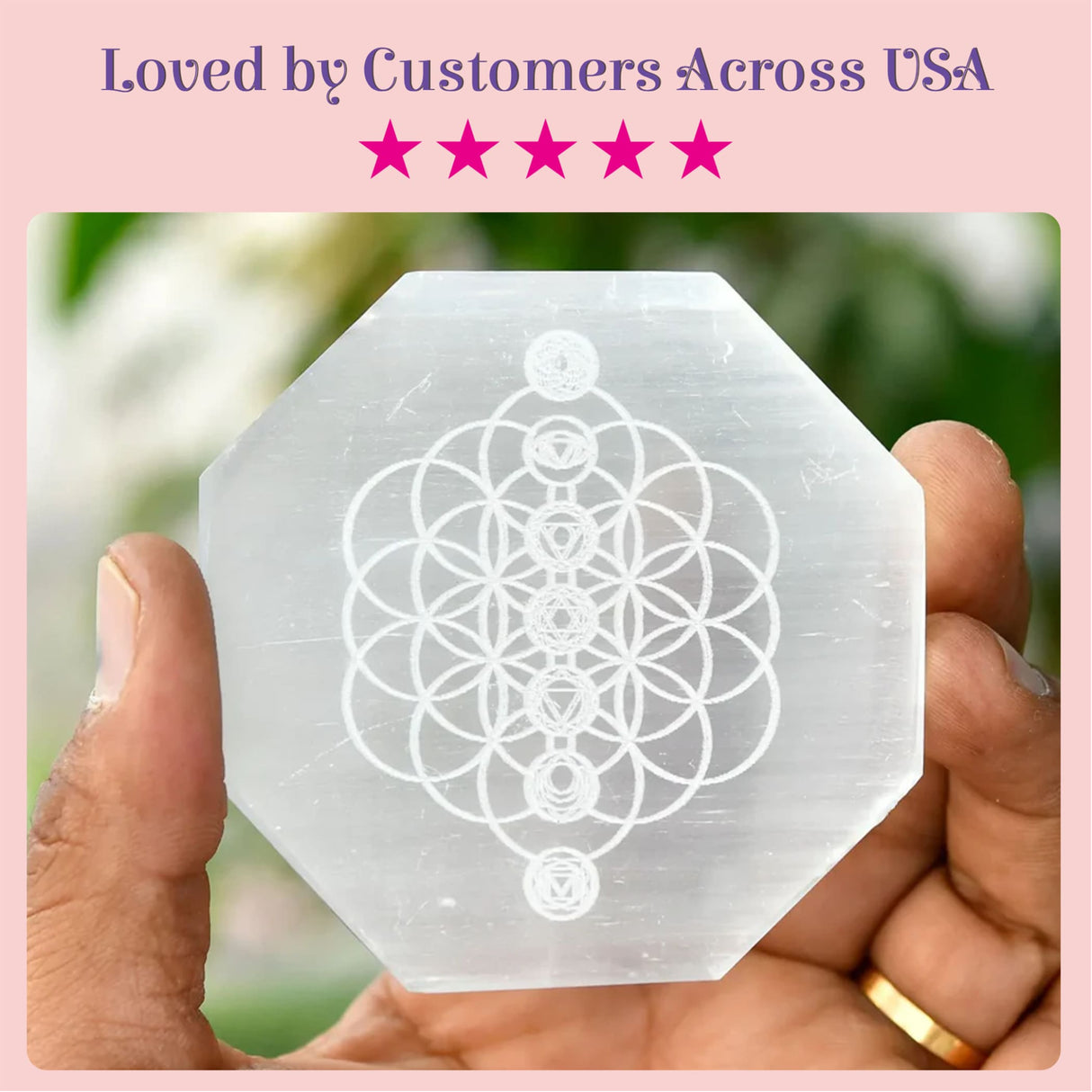 A translucent octagonal white selenite charging plate with flower of life and chakra symbols for crystals and healing stones