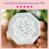 Translucent hexagonal selenite charging plate engraved with om symbol and mandala design for crystals and healing stones