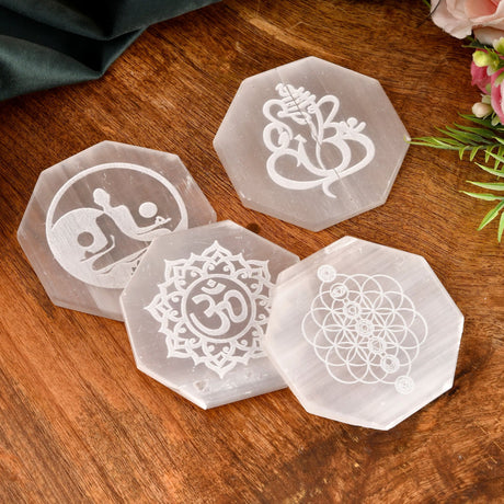 Octagonal Selenite crystal coasters with engraved symbols for crystal charging and decor