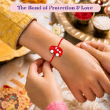 A vibrant red car-shaped rakhi with white circular details on a wrist, cute cartoon car rakhi bracelet for brother