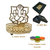 Gold-colored Ganesha shadow diya holder with intricate base, gift box, and rose fragrance candles