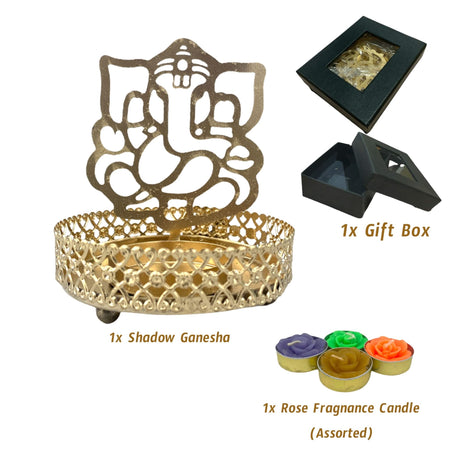Gold-colored Ganesha shadow diya holder with intricate base, gift box, and rose fragrance candles