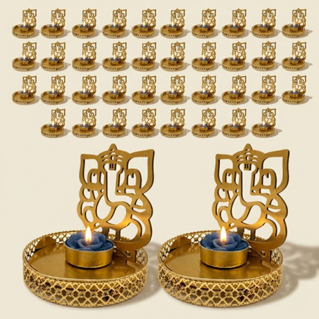 Golden ornate ganesha-themed tea light candle holders with intricate cut-out designs and decorative bases for diwali decor