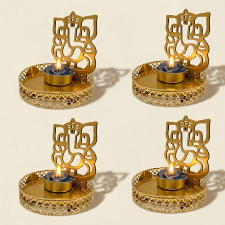 Golden metal ganesha tea light candle holder with intricate cut-out designs for diwali home decor and pooja