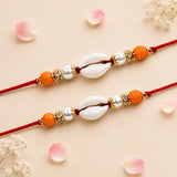 Two orange and white shell-themed rakhi bracelets with gold-toned accents traditional handcrafted protection gift