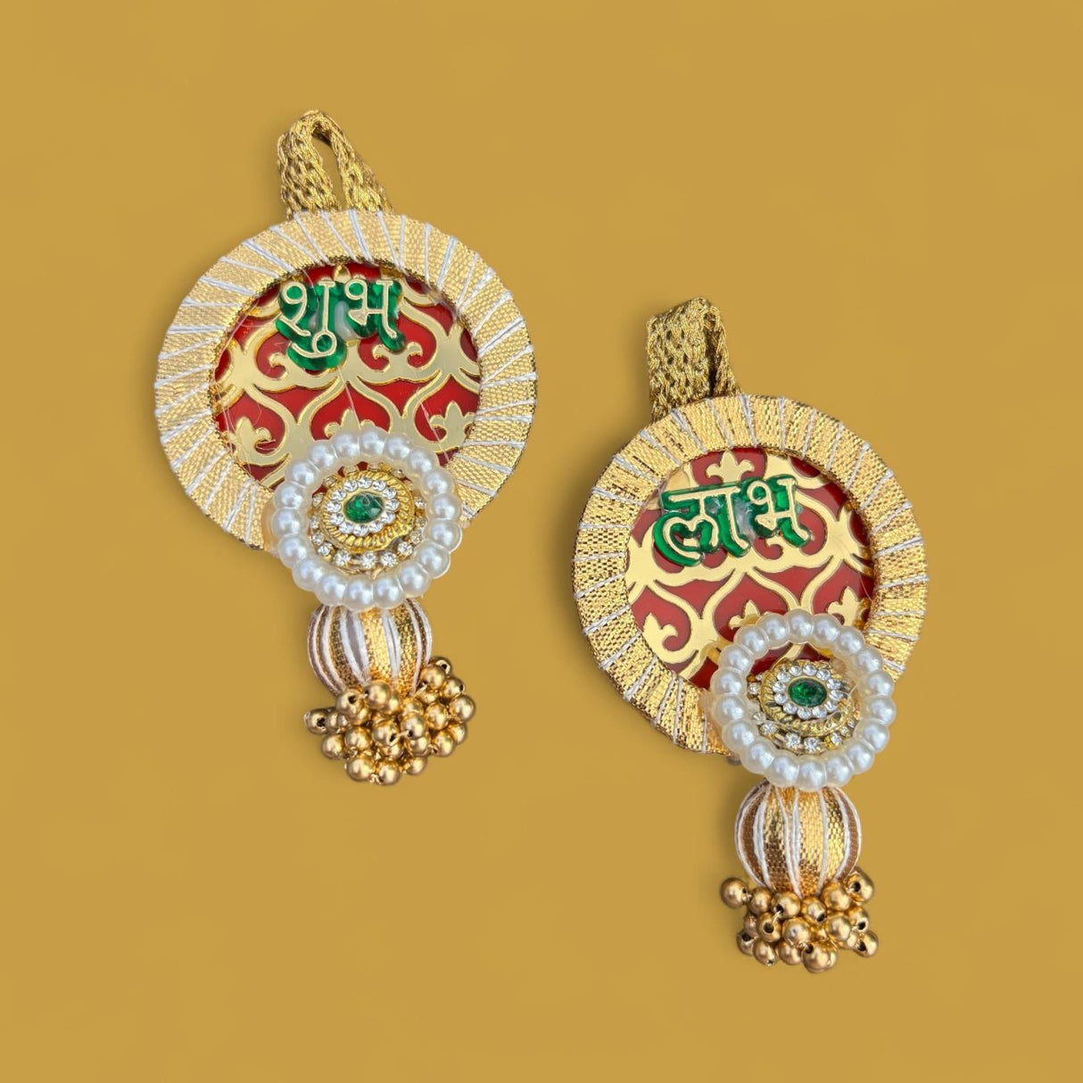 Ornate gold and red Shubh Labh hanging decor with pearls, emerald-like stone, and beads