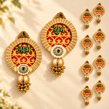 Gold-toned shubh labh hanging decor with red yellow patterns green devanagari script and pearl bead clusters for diwali and home decor