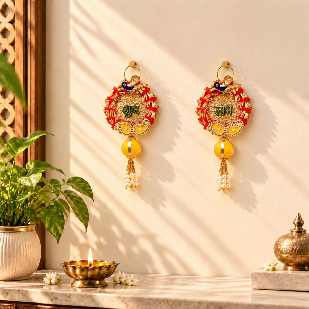 Golden meenakari rangoli hangings with red and yellow embroidered peacock designs and pearl tassels for diwali decor