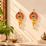 Golden meenakari rangoli hangings with red and yellow embroidered peacock designs and pearl tassels for diwali decor