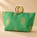 Green silk cosmetic bag with gold leaf pattern and pearl-adorned handle for Eid and Diwali gift favors