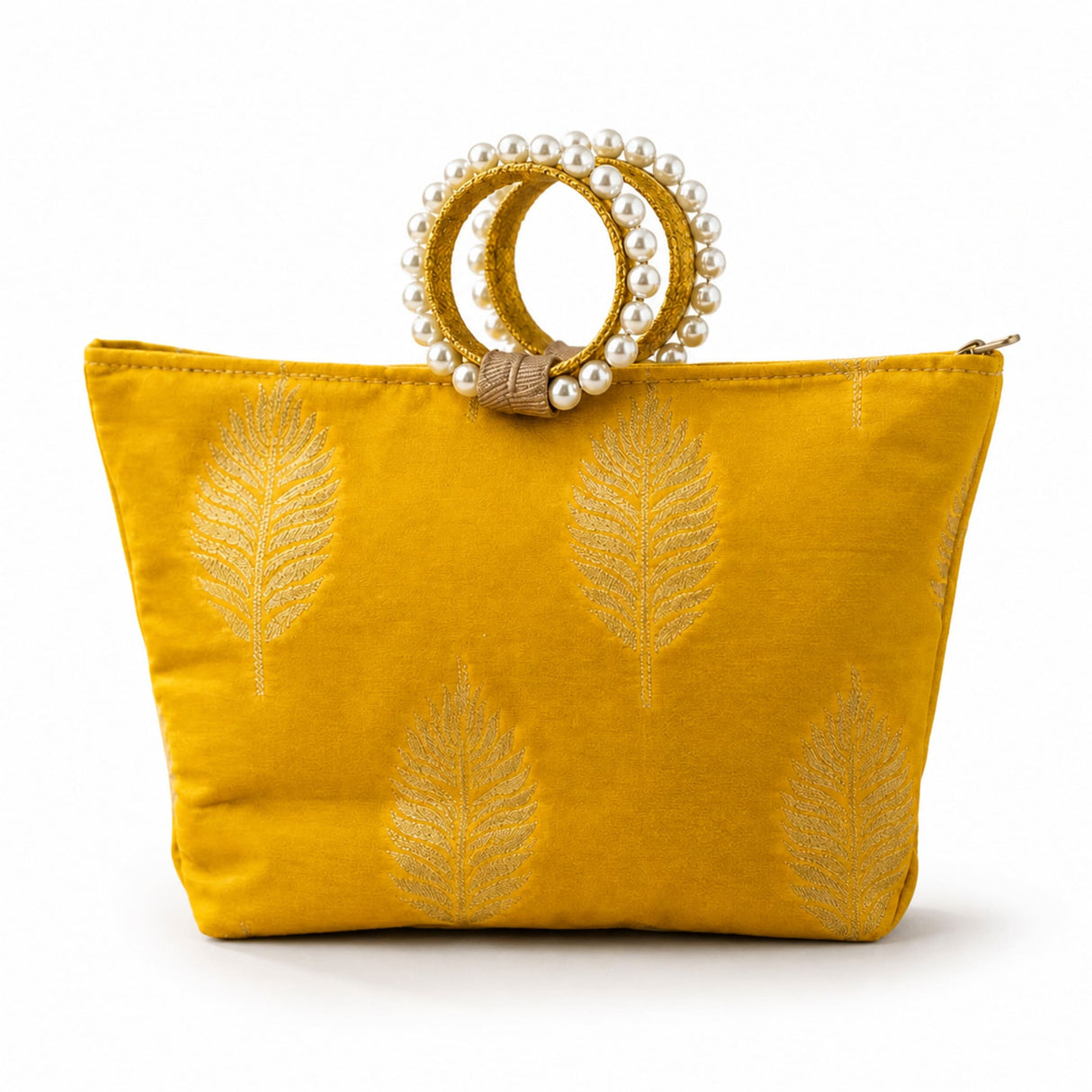 A vibrant mustard-yellow silk handbag with gold-embroidered leaf patterns and pearl-adorned handle for Eid and wedding favors