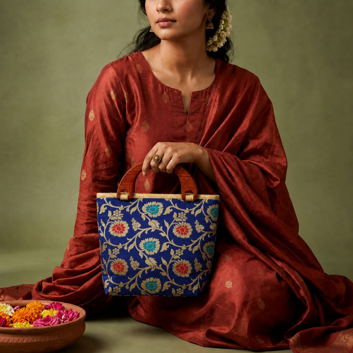 Blue floral-patterned woven handbag with wooden handles traditional Indian embroidered silk bag for festival occasions