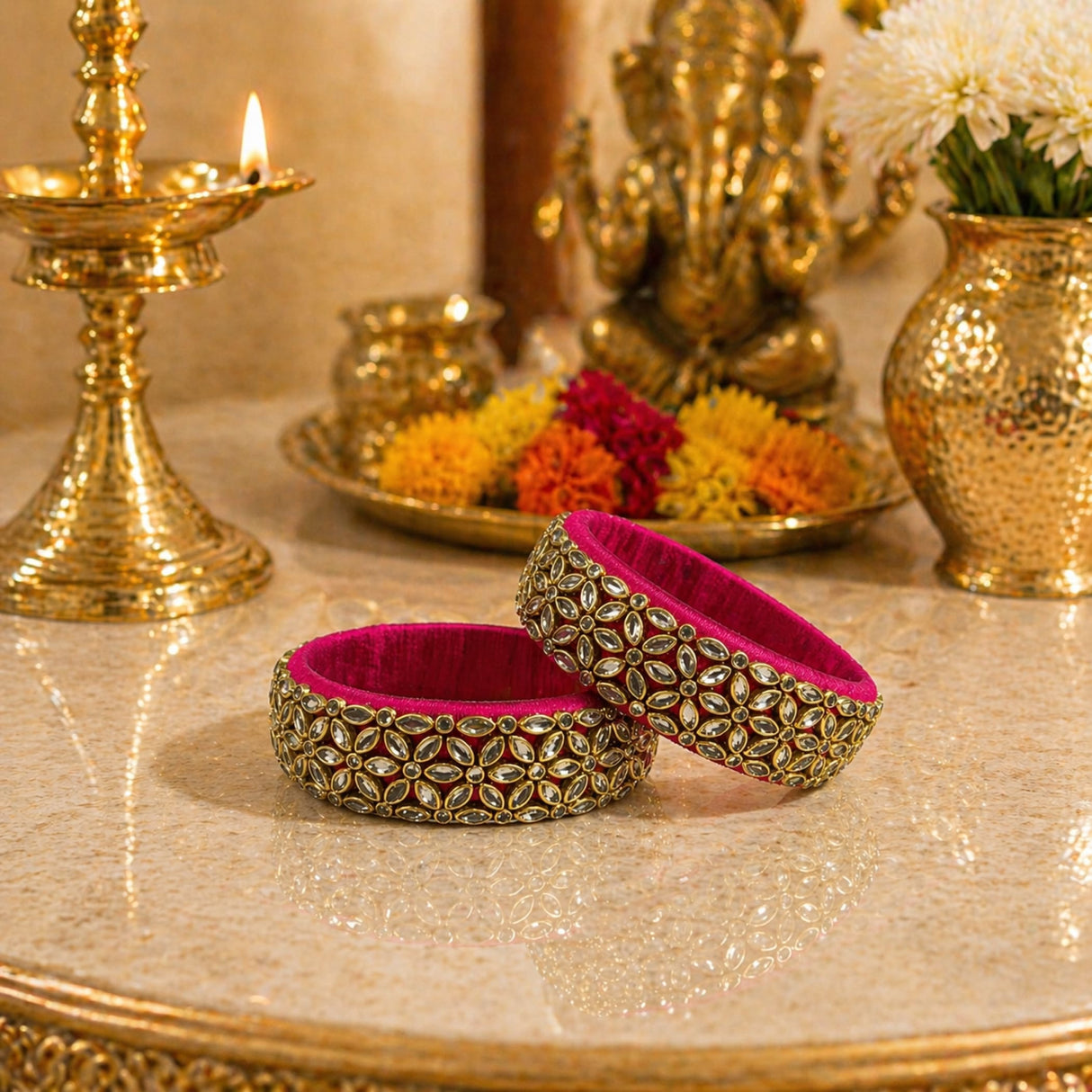 Vibrant fuchsia Indian silk thread bangles with intricate gold-tone floral patterns and sparkling rhinestones for women