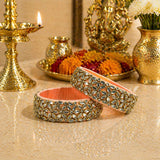 Elegant peach-colored Indian silk thread bangles for women with gold-tone metalwork and sparkling kundan stones