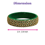 Emerald green velvet Indian silk thread bangle with intricate gold-toned metalwork and faceted stones for bridal use